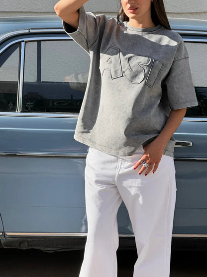 THE ASILI PATCH T-SHIRT IN WASHED GREY